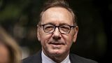 Actor Kevin Spacey looks on as he arrives at Southwark Crown Court, London