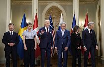 President Joe Biden waves following a family photo with Nordic leaders  at the Presidential Palace in Helsinki, Finland, Thursday, July 13, 2023.