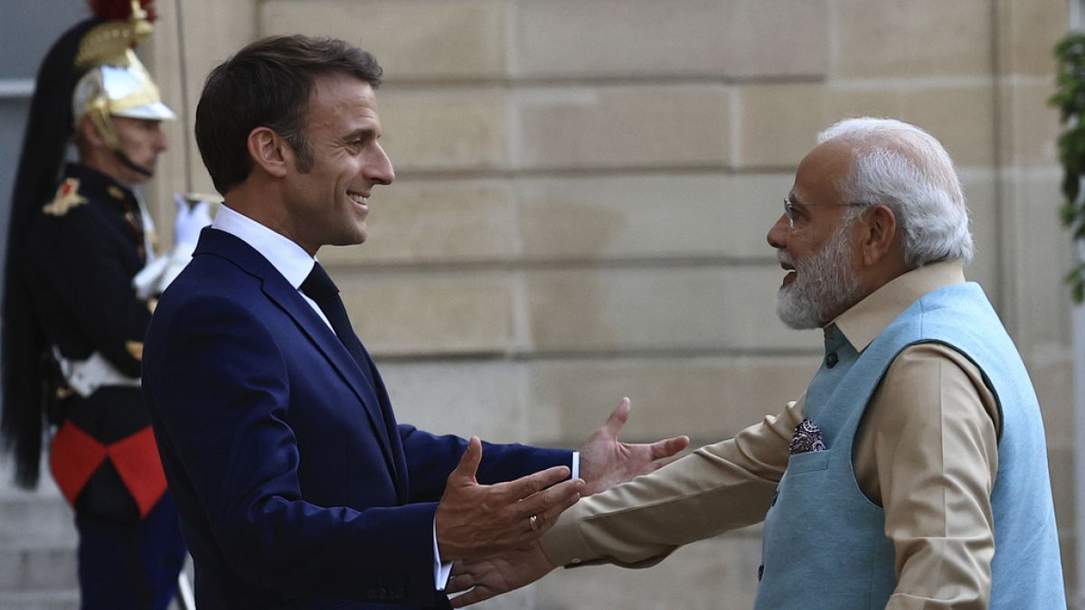 French President Emmanuel Macron welcomes Indian Prime Minister Narendra Modi before a working dinner, Thursday, July 13, 2023 at the Elysee Palace, in Paris.