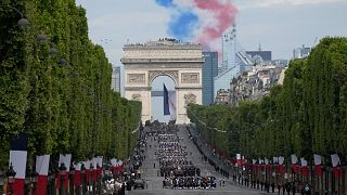 Alphajets of the Patrouille de France fly over the Champs-Elysees avenue during the Bastille Day parade.