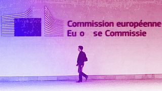 A man walks outside the European Commission headquarters in Brussels, July 2013