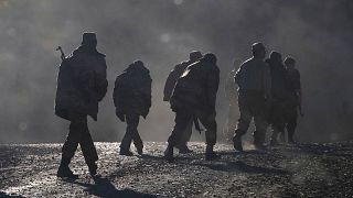  Ethnic Armenian soldiers walk along the road near the border between Nagorno-Karabakh and Armenia