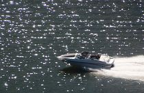 FILE: Boat speeds throught the sunlight sparkling off the Monongahela River, Pittsburgh