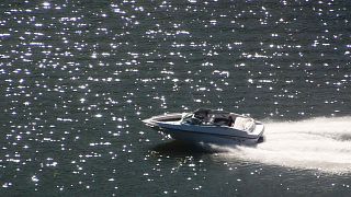 FILE: Boat speeds throught the sunlight sparkling off the Monongahela River, Pittsburgh