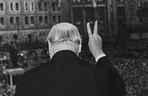 The crowd cheers as Winston Churchill makes his famous "V" for victory sign after addressing a rally in Strasbourg, France, August 12, 1949.