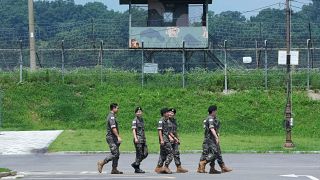 A North Korean military guard post, rear, and South Korea post, bottom, are seen in Paju near the border with North Korea, South Korea, Tuesday, July 18, 2023.
