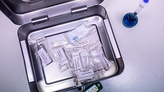 A sample of a "Blue Punisher" Ecstasy Pill, along with other drug samples are stored in a box at Berlin's forensic medicine department in Berlin, Germany, July 10, 2023.