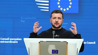 Ukraine's President Volodymyr Zelenskyy addresses a media conference at an EU summit in Brussels.