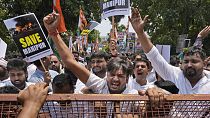 Members of the youth wing of India's Congress party shout slogans during a protest near Parliament House in New Delhi, India, Thursday, July 20, 2023.