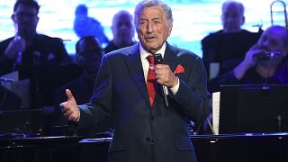 FILE - Tony Bennett performs at the Statue of Liberty Museum opening celebration on May 15, 2019, in New York