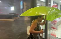 Pedestrian with umbrella. 