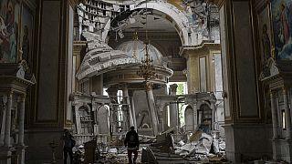 Church personnel inspect damages inside the Odesa Transfiguration Cathedral in Odesa, Ukraine, Sunday, July 23, 2023, following Russian missile attacks.