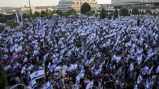 Israelis protest against Prime Minister Benjamin Netanyahu's judicial overhaul plan outside the parliament in Jerusalem, Sunday, July 23, 2023.