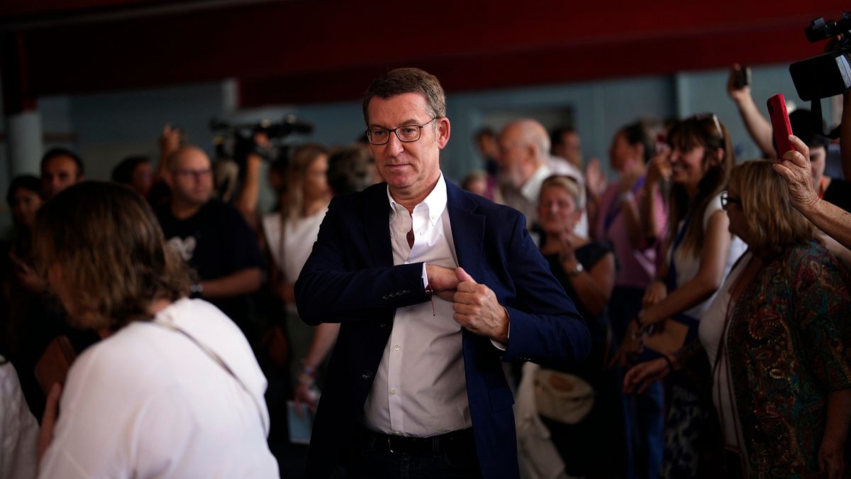 Popular Party leader Alberto Nunez Feijoo leaves a polling station after voting in Madrid