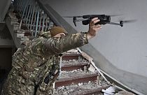 A Ukrainian soldier launches a drone in the area of the heaviest battles with the Russian invaders in Bakhmut, Donetsk region, Ukraine, Wednesday, March 15, 2023.