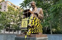 The statue of journalist Indro Montanelli with black and yellow tape