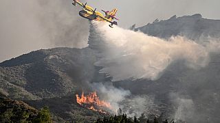 Fire fighting plane drops water over a wildfire close to village of Vati in the southern part of the Greek island of Rhodes, July 23rd 2023