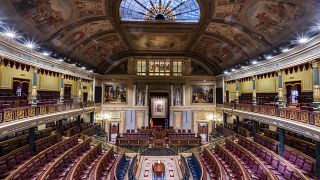 FILE - Empty seats inside Spanish parliament's lower house in Madrid, Spain, July 2023