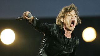 Mick Jagger performs during the Rolling Stones concert at the San Siro stadium in Milan, Italy, Tuesday, July 11, 2006. 