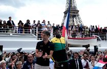 Тони Эстанге и Усэйн Болт на презентации олимпийского факела, набережная Сены, 25 июля 2023 года.