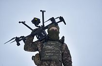 A Ukrainian soldier carries a drone close to the frontline near Avdiivka, Donetsk region, Ukraine, Friday, Feb. 17, 2023. 
