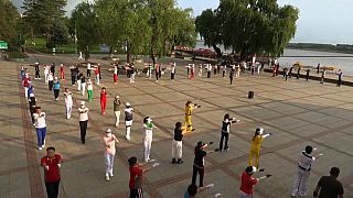 Retirees dancing in a public square in China
