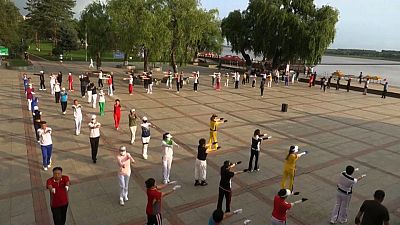 Retirees dancing in a public square in China