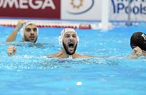 Greece's Konstantinos Genidounias celebrates after scoring a goal against Hungary during their men's water polo gold medal match at the World Swimming Championships in Fukuoka