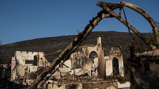 Une maison brûlée près du village de Gennadi, sur l'île de Rhodes en mer Égée, au sud-est de la Grèce, le mercredi 26 juillet 2023.
