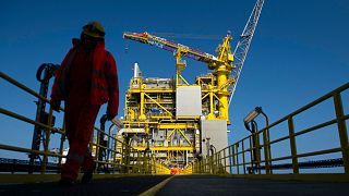 FILE: An employee walks along the Total Culzean platform on the North Sea, about 45 miles (70 kilometres) east of the Aberdeen