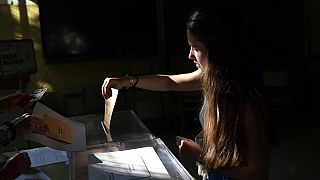 A woman casts her vote at a polling station in Pamplona, Spain, Sunday July 23, 2023.