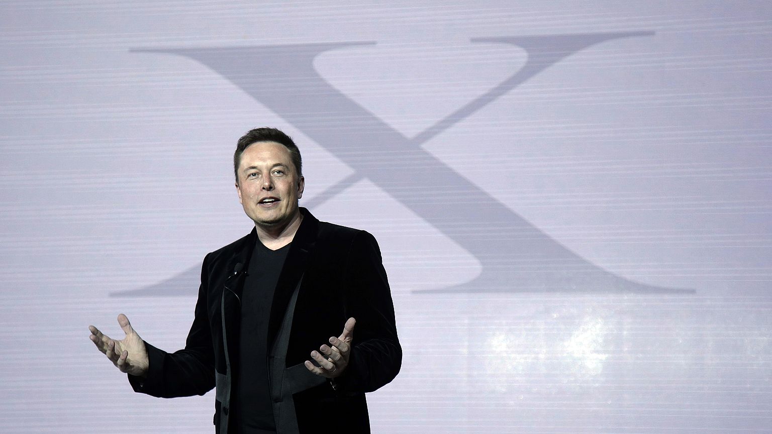 Elon Musk, CEO of Tesla Motors Inc., introduces the Model X car at the company's headquarters Tuesday, Sept. 29, 2015, in Fremont, Calif.