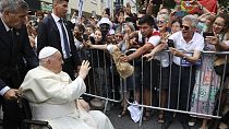 Pope Francis waves to the crowd as he arrives for a meeting with the Portugal's Prime Minister Antonio Costa in Lisbon, Wednesday, Aug. 2, 2023. 