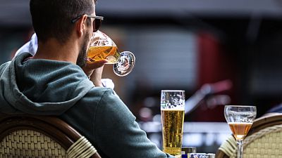 A man drinks a beer at a cafe terrace in Toulouse, southwestern France, 11 May 2023.