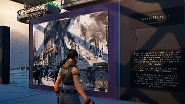 A character interact with a Kristallnacht display