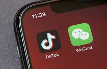 Icons for the smartphone apps TikTok and WeChat are seen on a smartphone screen in Beijing.