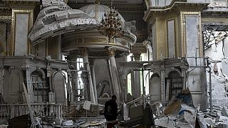 A church personnel inspects damages inside the Odesa Transfiguration Cathedral in Odesa, Ukraine, Sunday, July 23, 2023