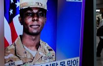 A TV screen shows a file image of American soldier Travis King during a news program at the Seoul Railway Station in Seoul, South Korea, Monday, July 24, 2023.