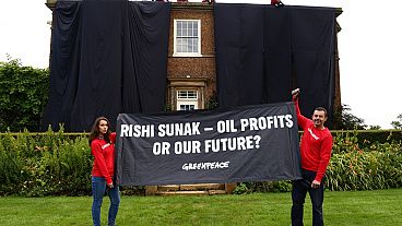 Greenpeace activists at British premier's private house