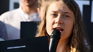 Swedish climate campaigner Greta Thunberg speaks as she takes part in a demonstration with activists in favor of the nature restoration law in front of the European Parliament