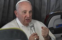 Pope Francis meets the journalists during a press conference aboard the aeroplane directed to Rome, at the end of the 37th World Youth Day in Lisbon, Sunday, Aug. 6, 2023.