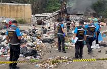 Forensic police in Thailand search the rubbish dump where body parts were discovered in  Koh Pha Ngan