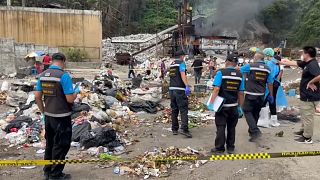Forensic police in Thailand search the rubbish dump where body parts were discovered in  Koh Pha Ngan