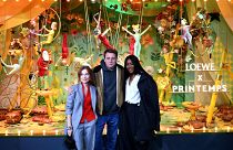  Isabelle Huppert, Jonathan Anderson and Naomi Campbell pose in front of Printemps Haussmann store in Paris after unveiling their Loewe-designed Christmas windows, 2022