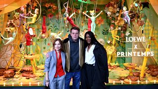  Isabelle Huppert, Jonathan Anderson and Naomi Campbell pose in front of Printemps Haussmann store in Paris after unveiling their Loewe-designed Christmas windows, 2022