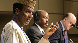 File: Niger’s minister of Economy and Finance,  Ali Mahaman Lamine Zeine, (left) briefs reporters at IMF Headquarters, Washington DC. October 12, 2008