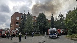 Emergency workers at the scene of the pyrotechnic explosion at a warehouse north of Moscow