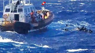 This handout photograph taken on August 5, 2023 by Italian Coastguard (Guardia Costeria) and released on August 6, shows a rescue operation that took place south of Lampedusa.
