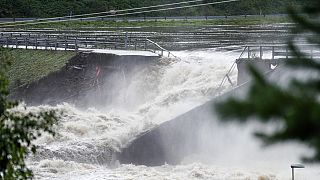 Water breaks through the dam at Braskereidfoss, Norway, Wednesday, Aug. 9, 2023.