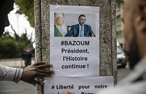 Demonstrators gather in front of the Embassy of Niger in Paris, in support of Nigerien President Mohamed Bazoum and ECOWAS, Saturday, Aug. 5, 2023.